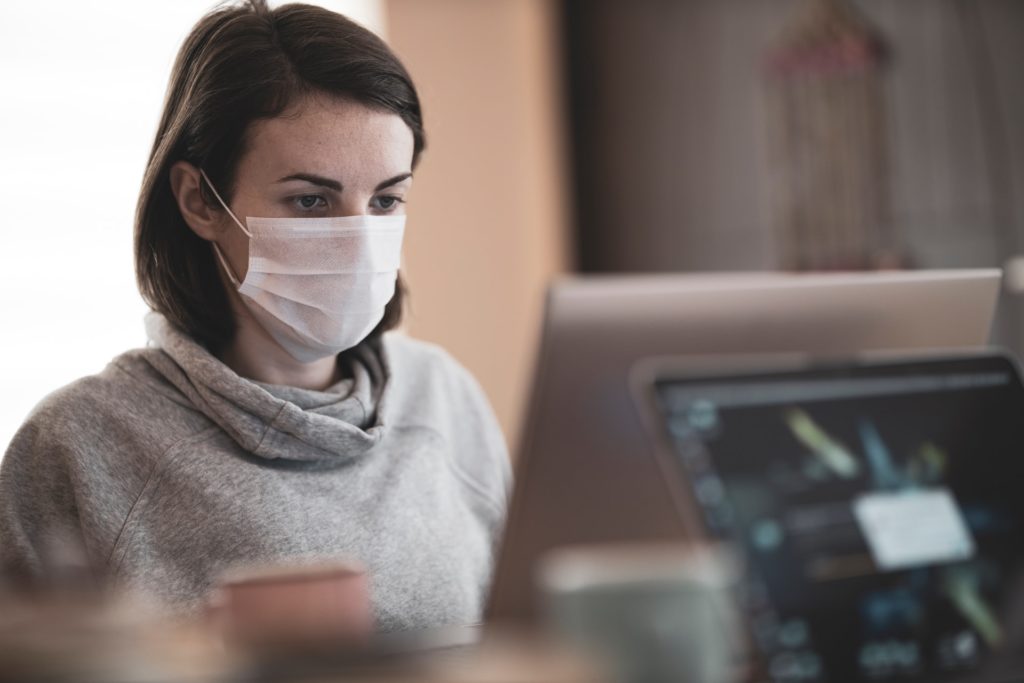 image of lady on laptop to support article about the impact of the pandemic on paralegals