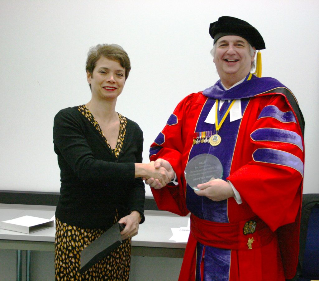 Amanda awarding Peter Minto lifelong service to NALP and Paralegal Profession